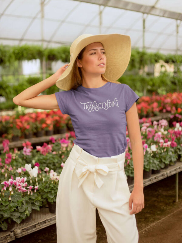 AwakeNAware.com-Awake-&-Aware-Girl-Posing-In-Front-of-Flowers-Wearing-Transcending-Goddess-TShirt